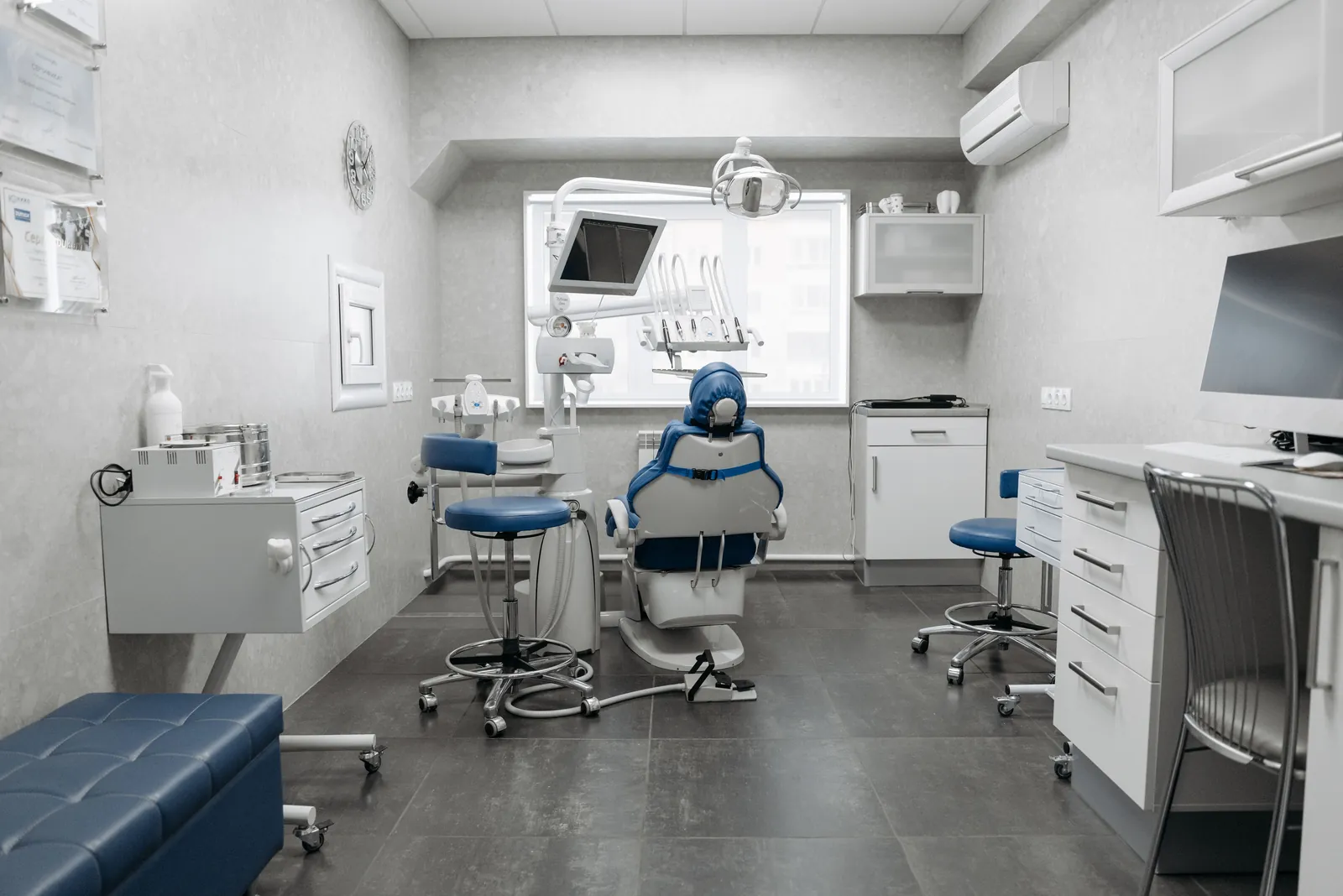 Modern dental operatory with surgical chair and equipment